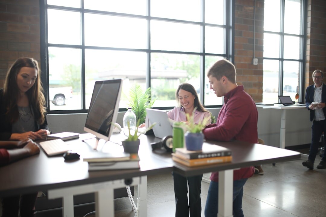 Team reviewing notes together around a table in an office