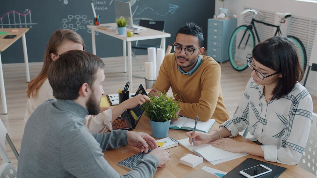 Group of people engaged in an animated discussion around a table